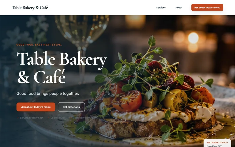 Sample Table restaurant website design on a laptop